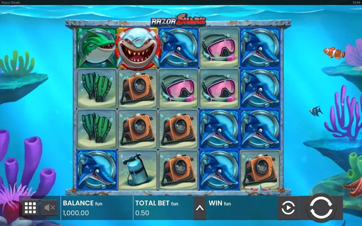 Basisspiel-Walzen: Wild-Hai oben links, verschiedene Hai- und Tauchsymbole, Clownfisch am rechten Rand.